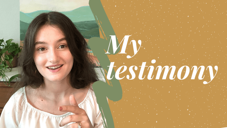 A Picture of me from the video; I'm wearing a white blouse and in the background is a painting of a mountain. Words overlaying the picture say, "My testimony".